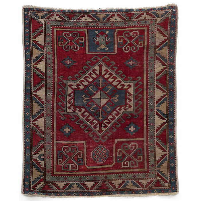 Appraisal: Persian rug geometric pattern in blue and browns on a