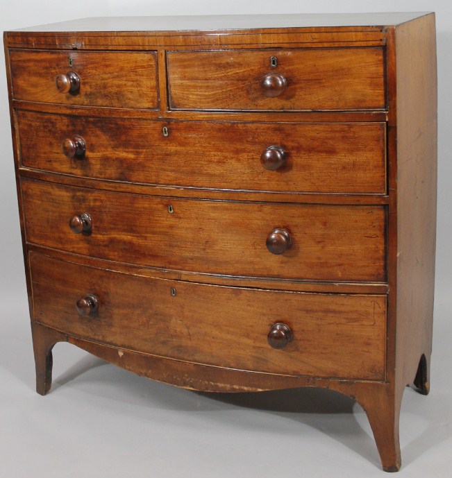 Appraisal: A George III mahogany bow front chest of two short