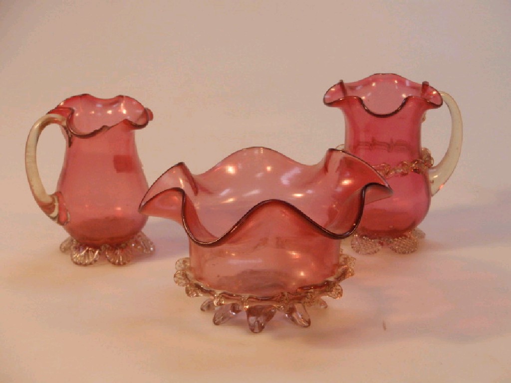 Appraisal: A Victorian cranberry glass sugar bowl with clear glass prints