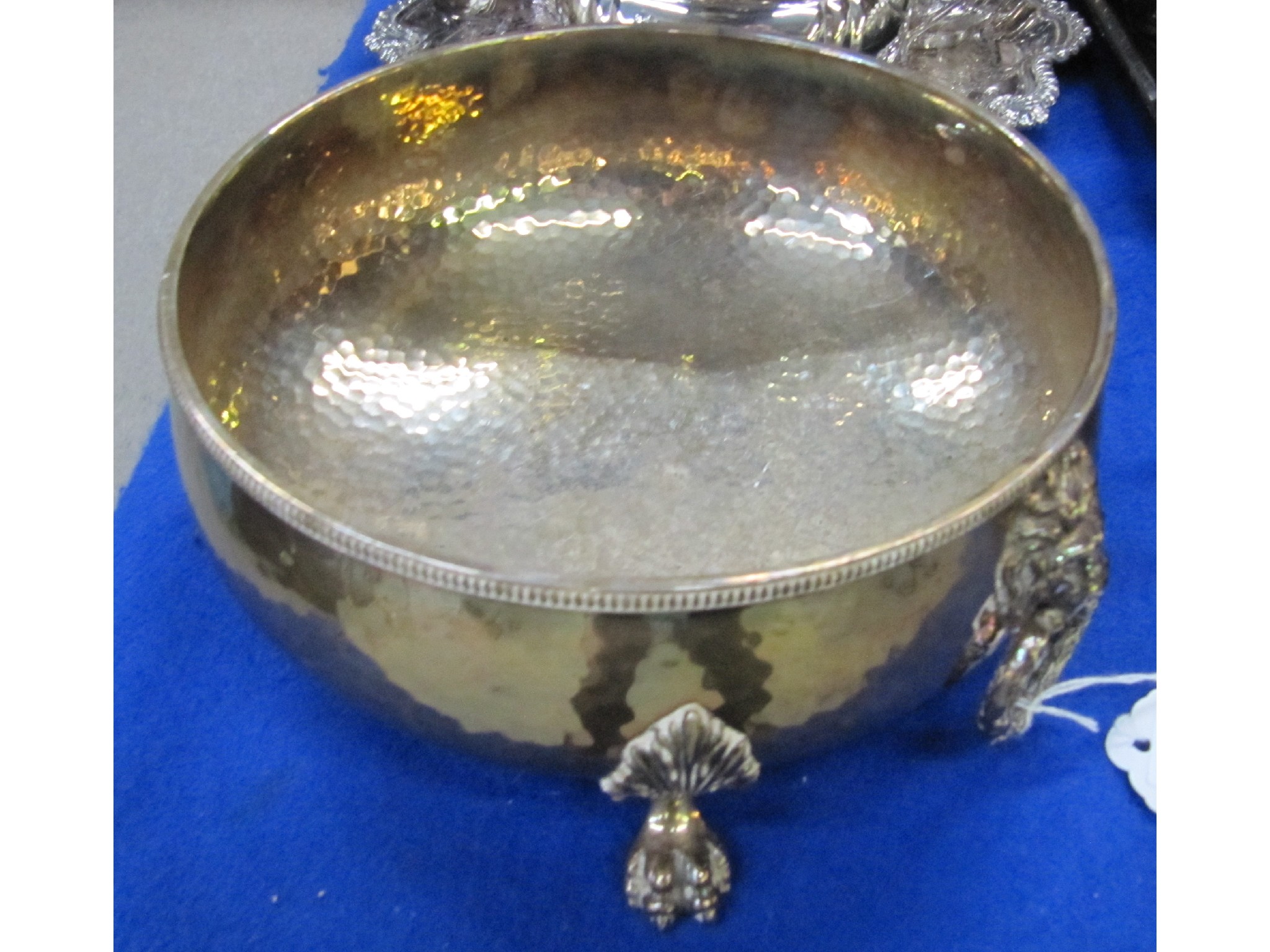 Appraisal: A hammered EP bowl with lion's mask handles