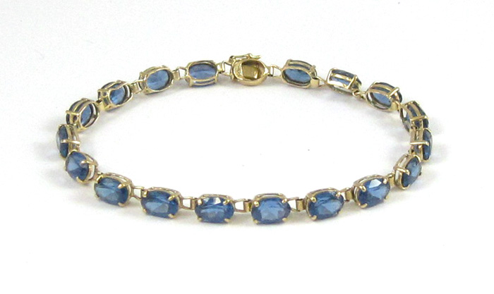 Appraisal: SYNTHETIC BLUE SPINEL BRACELET k yellow gold set with oval-cut