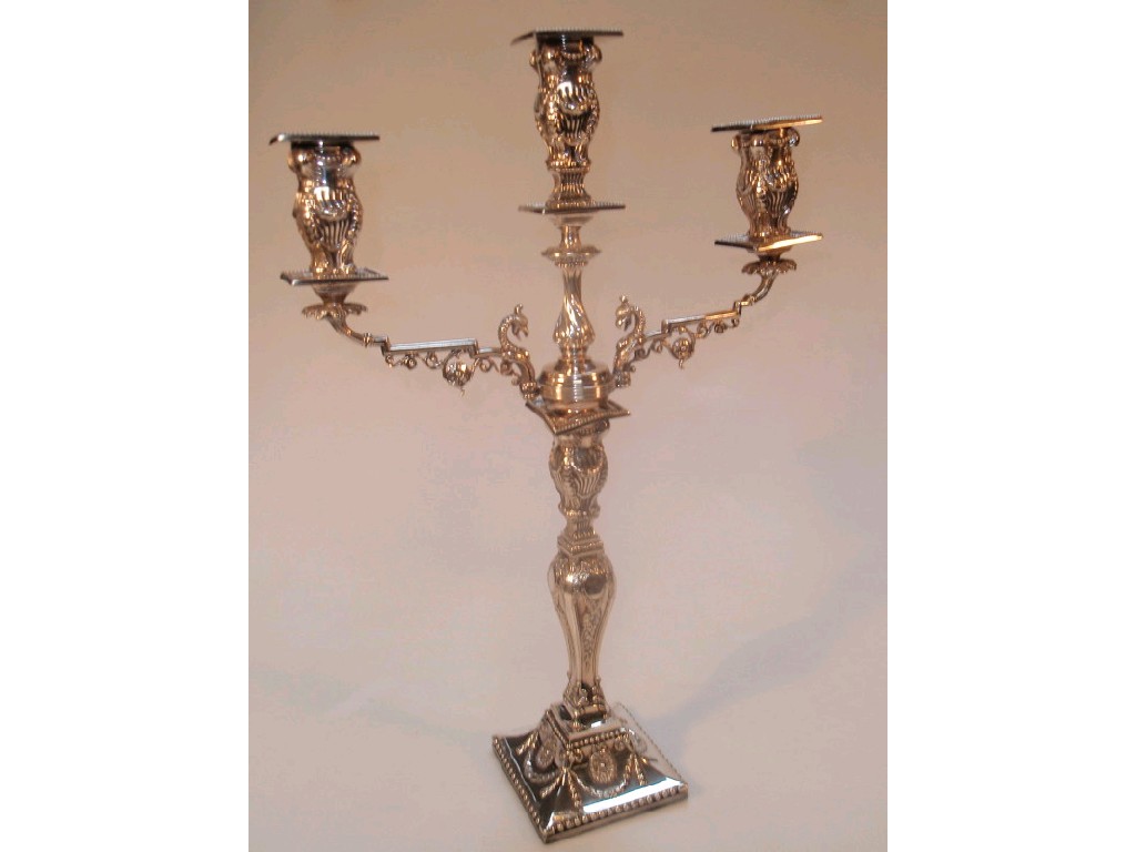 Appraisal: An electroplate candelabra by Walker Hall with three sconces supported