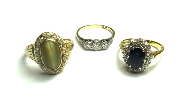 Appraisal: A gold and platinum ring mounted with three principal circular