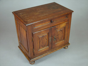 Appraisal: A provincial French walnut side cupboard th century with moulded