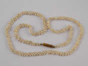 Appraisal: A seed pearl necklace with a yellow metal tests carat