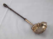 Appraisal: An th century silver punch ladle with turned hardwood handle