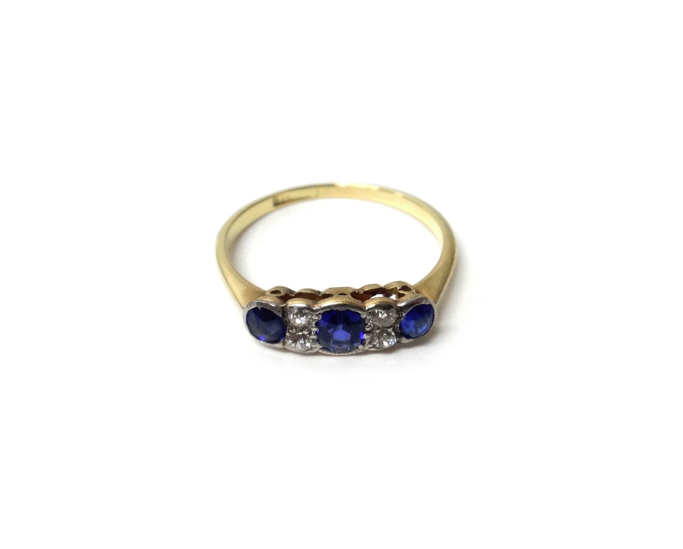 Appraisal: A gold and platinum diamond and sapphire set ring mounted