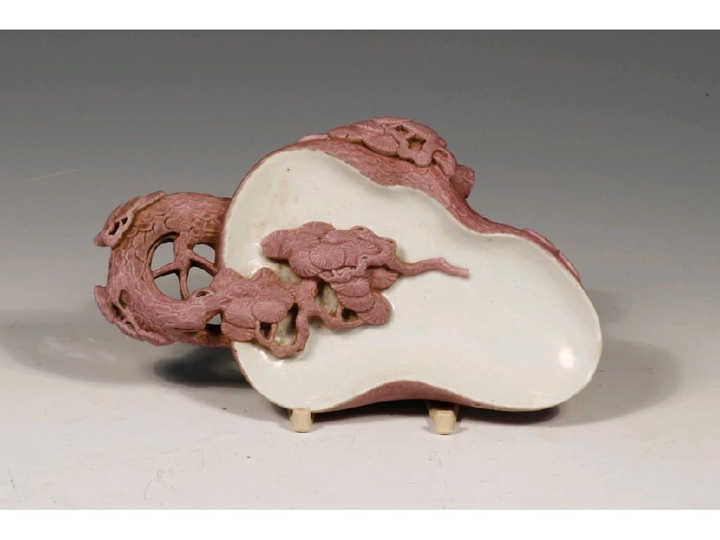 Appraisal: A CHINESE PORCELAIN BRUSH WASHER modelled as a leaf with