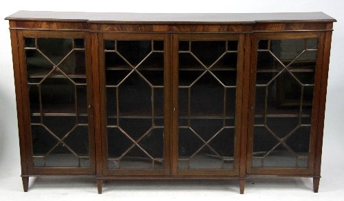 Appraisal: A George III style mahogany breakfront dwarf bookcase with astragal