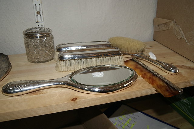 Appraisal: Small collection of silver mounted dressing table wareincluding three brushes