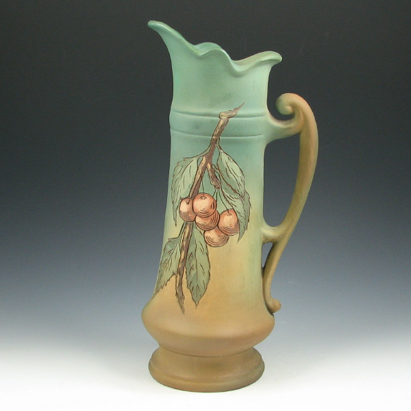 Appraisal: Weller Dickens Ware Pitcher Weller Dickens Ware tankard with cherry