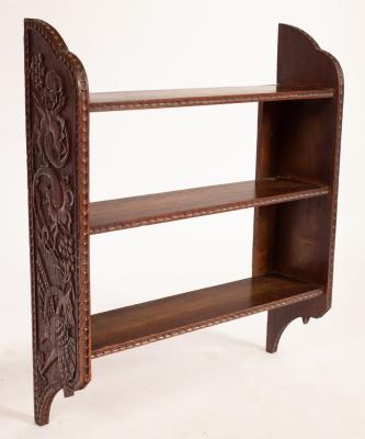 Appraisal: A set of carved oak hanging shelves cm wide