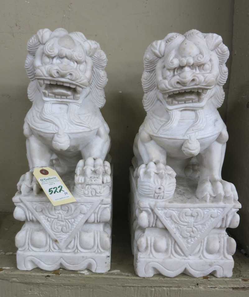 Appraisal: A PAIR OF CHINESE WHITE MARBLE FOO LIONS each in