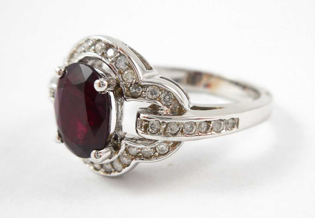 Appraisal: RUBY DIAMOND AND FOURTEEN KARAT WHITE GOLD RING with round-cut