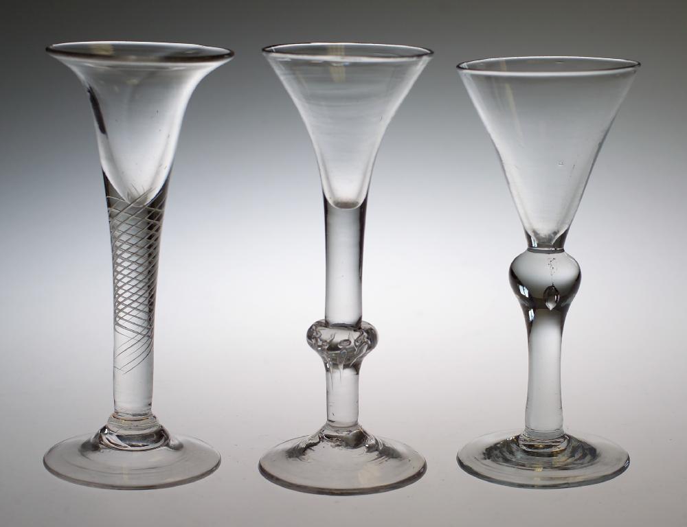 Appraisal: DRAWN TRUMPET WINE GLASS raised on a multi-spiral air twist