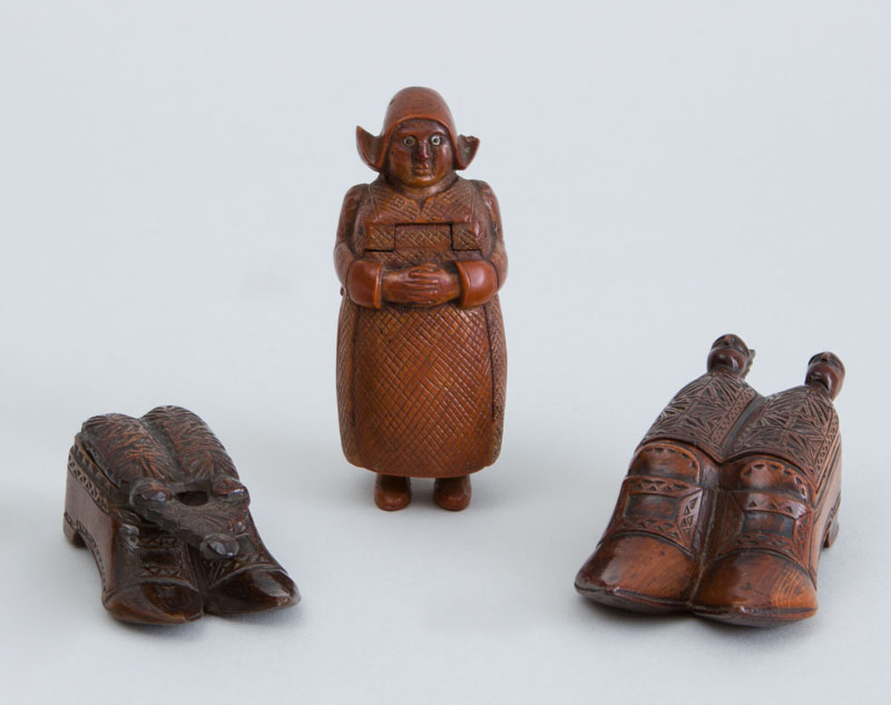 Appraisal: THREE CONTINENTAL CARVED WOOD FIGURAL SNUFF BOXES Two in the