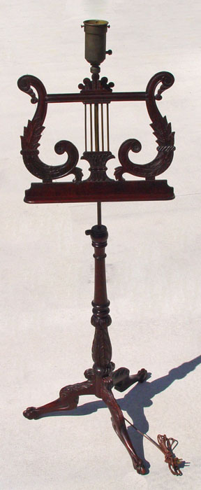 Appraisal: CARVED MAHOGANY MUSIC STAND LAMP Adjustable height music stand with