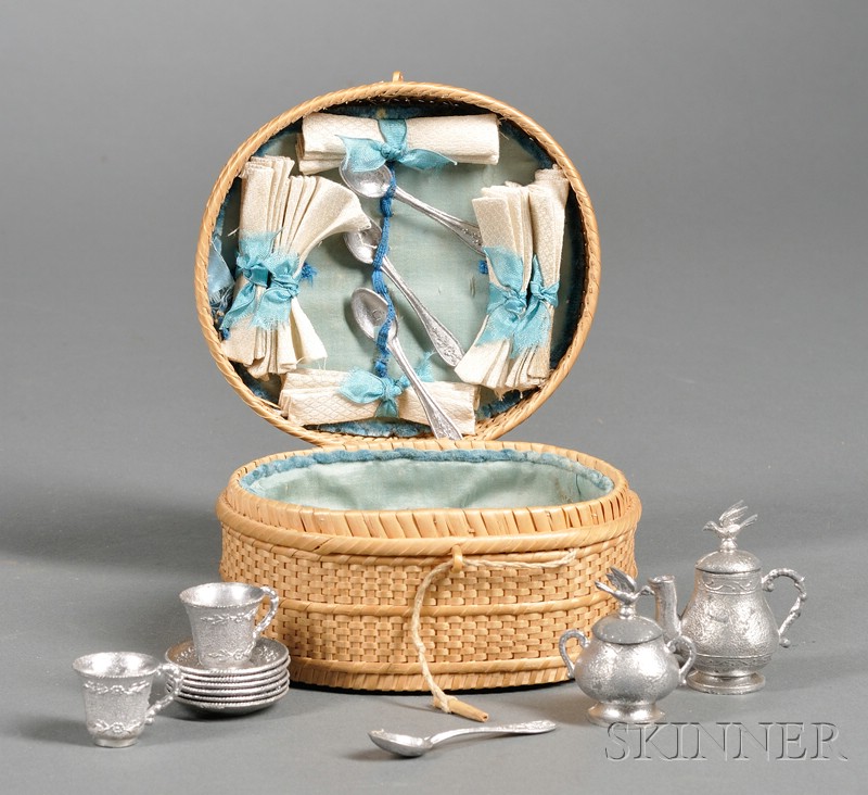 Appraisal: Doll Soft-Metal Tea Set in a Wicker Basket th century