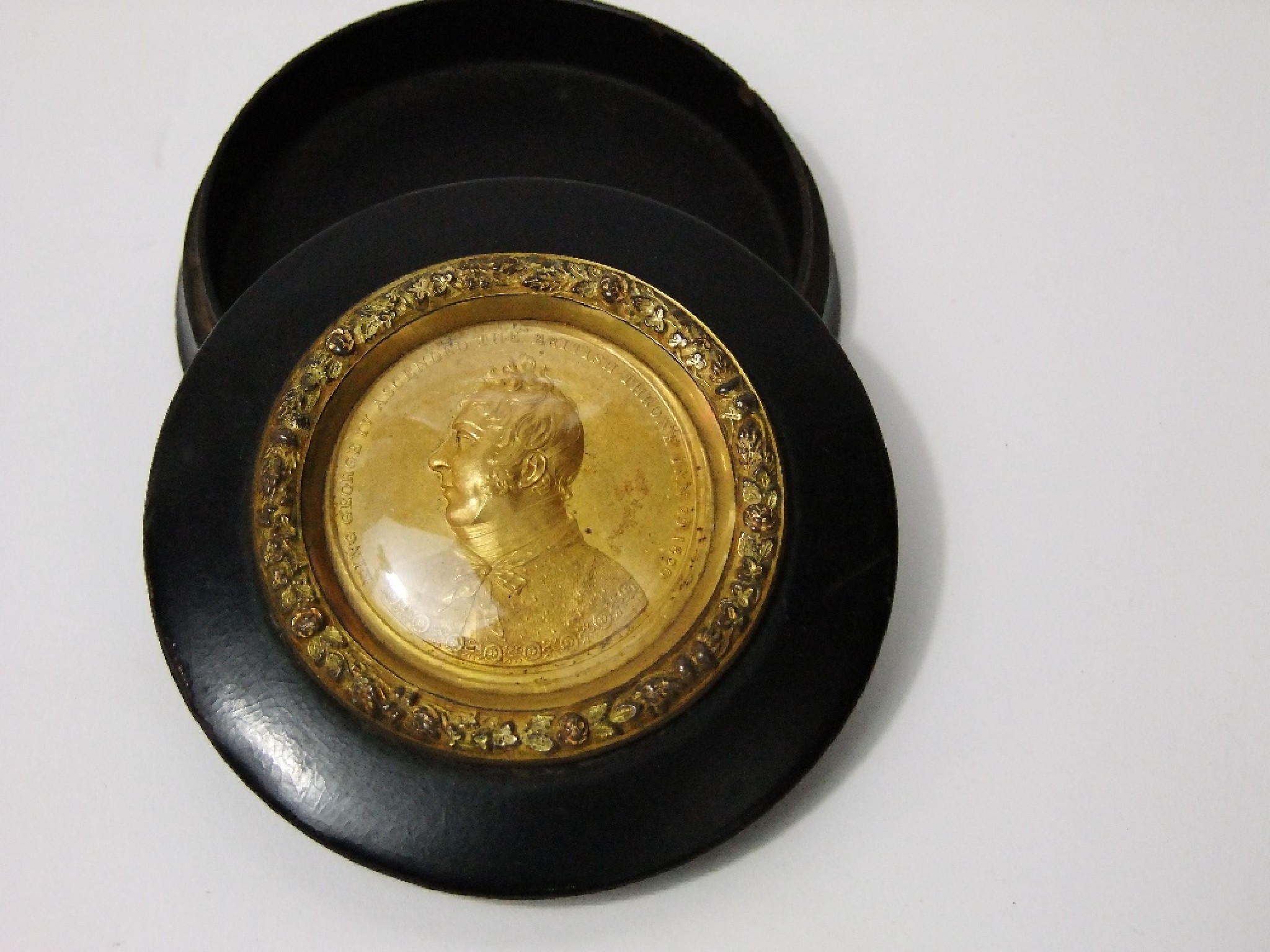 Appraisal: A circular lacquered box with gilded medallion inset commemorating the