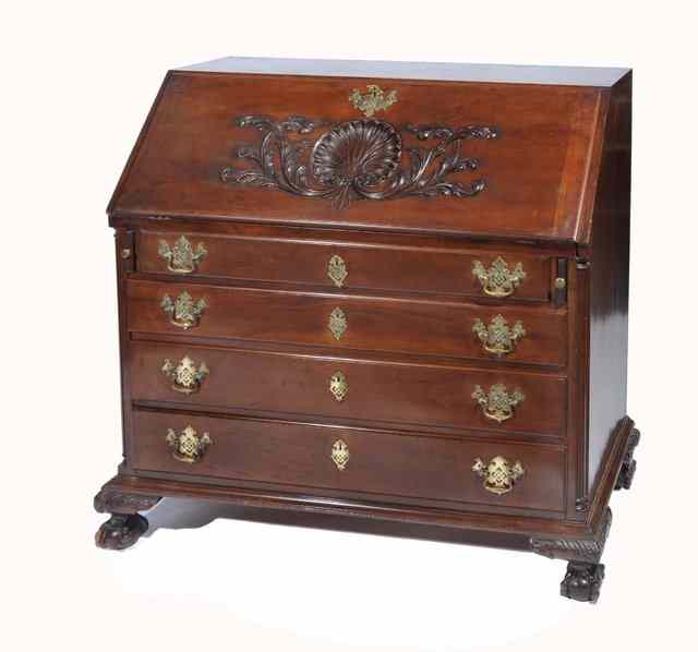 Appraisal: AN AMERICAN PHILADELPHIAN MAHOGANY BUREAU the interior fitted pigeon holes