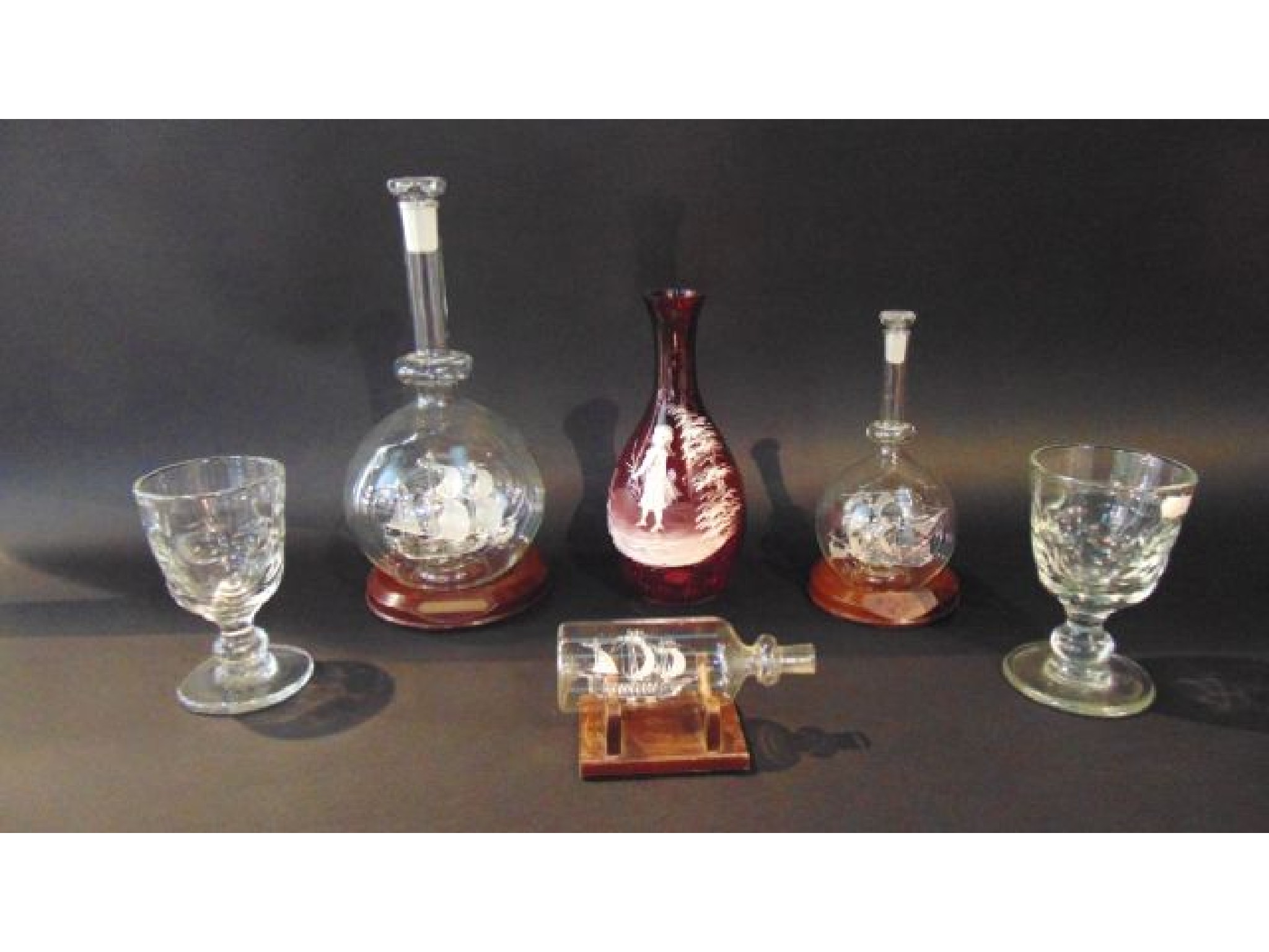 Appraisal: Three contemporary glass work models of galleons set within glass