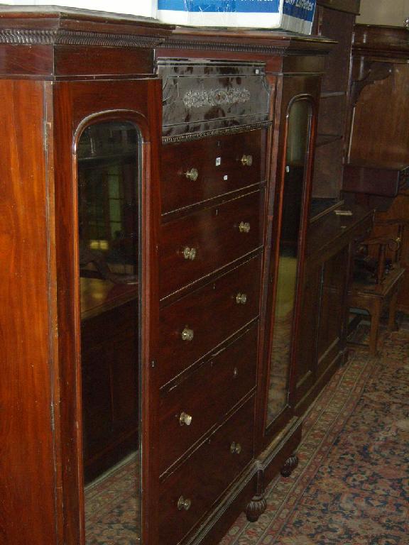 Appraisal: A th century mahogany sentry box wardrobe the centre section