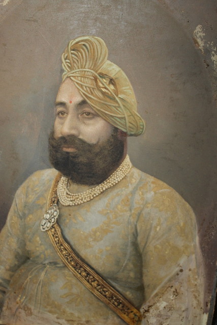 Appraisal: INDIAN SCHOOLAn oil portrait of an Indian Prince wearing a