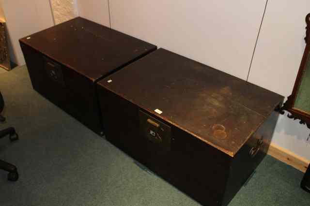 Appraisal: A PAIR OF CHINESE STAINED WOOD TRUNKS each with brass