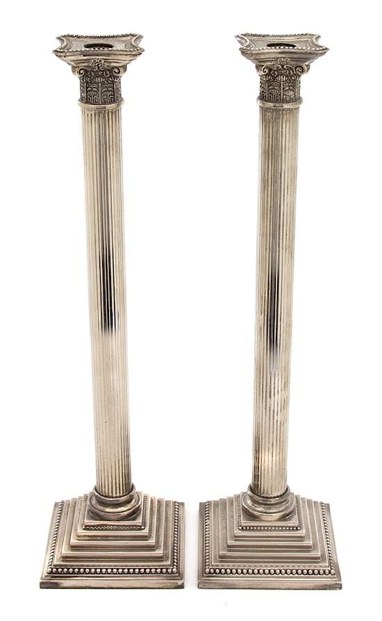 Appraisal: A Pair of Silver Plate Tall Columnar Candlesticks Height x