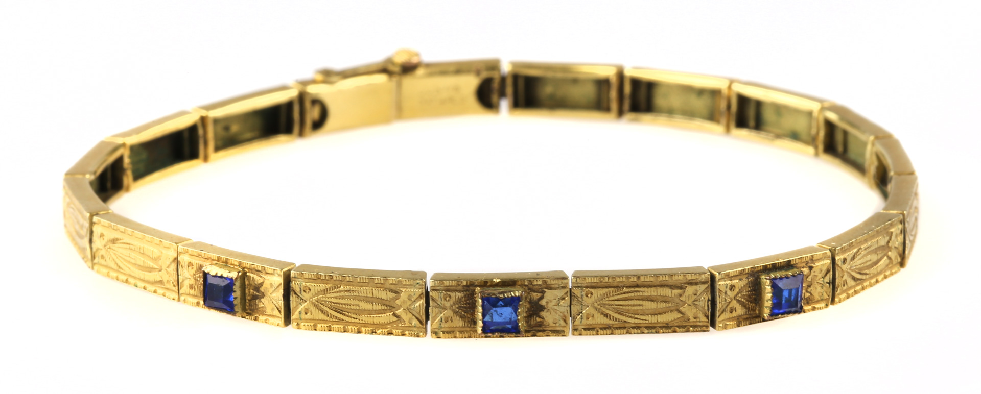 Appraisal: A Sapphire Bracelet in Gold K engraved bracelet with calibre