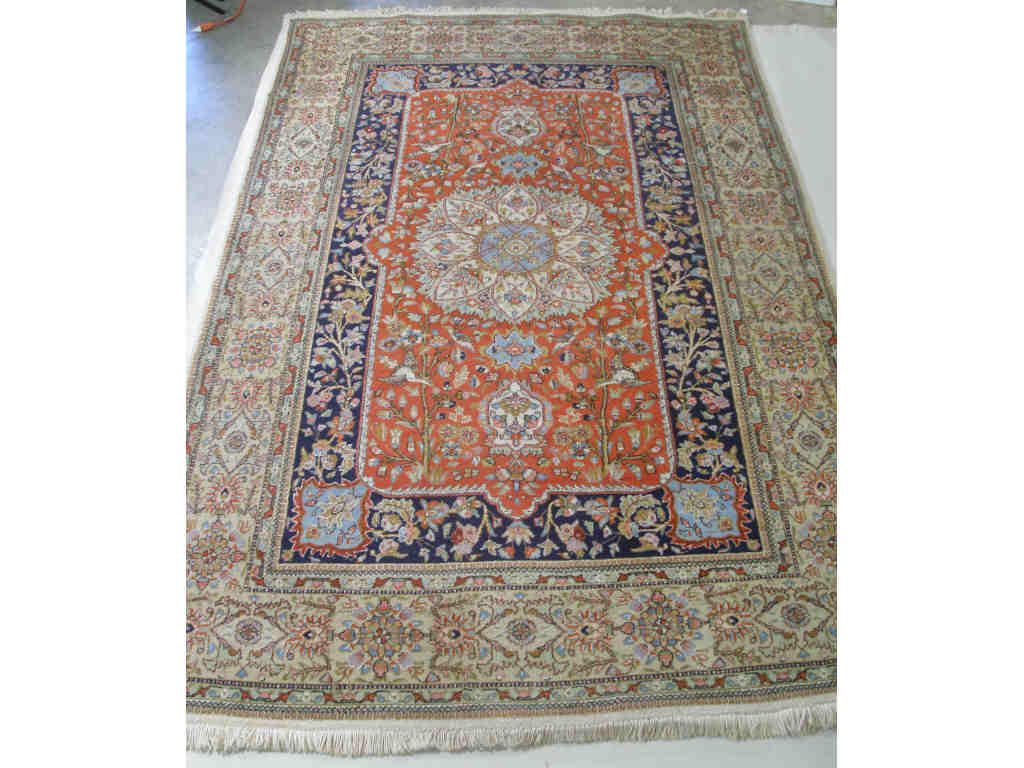 Appraisal: Oriental Carpet central eight petal floral medallion on orange field