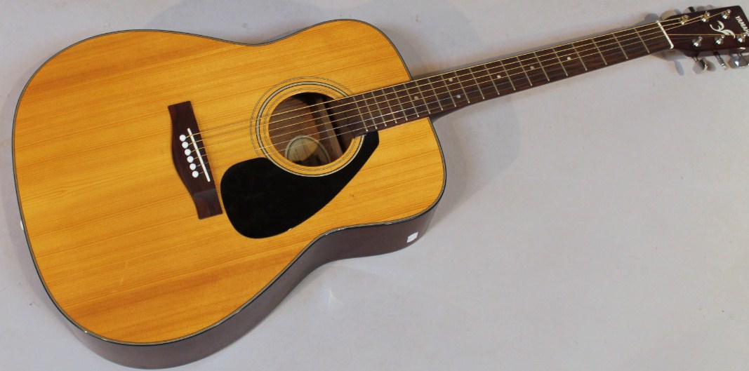 Appraisal: A thC Yamaha F- acoustic guitar with shaped body and