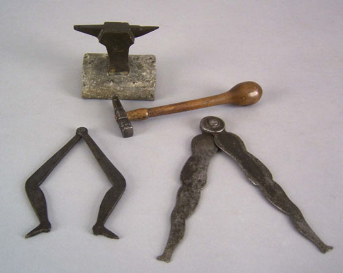 Appraisal: Two wrought iron leg form calipers together with a miniature