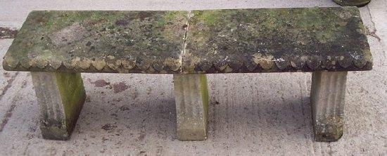 Appraisal: A two-slab garden seat on three shaped fluted supports cm