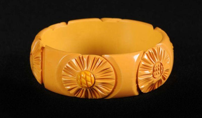 Appraisal: Bakelite Cream Carved Floral Bracelet Description Applied floral centers in