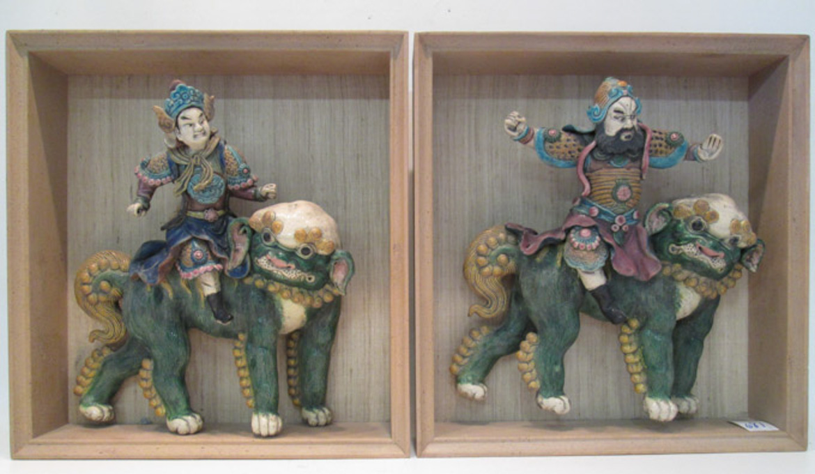 Appraisal: PAIR CHINESE POTTERY ROOF TILES MOUNTED IN SHADOWBOXES the figural