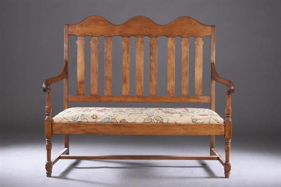 Appraisal: AMERICAN BANISTER-BACK SETTEE th century Nine vertical stayrails surmounted by