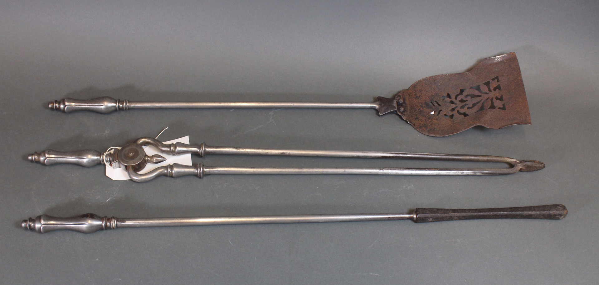 Appraisal: A set of three Victorian steel fire tools with lotus