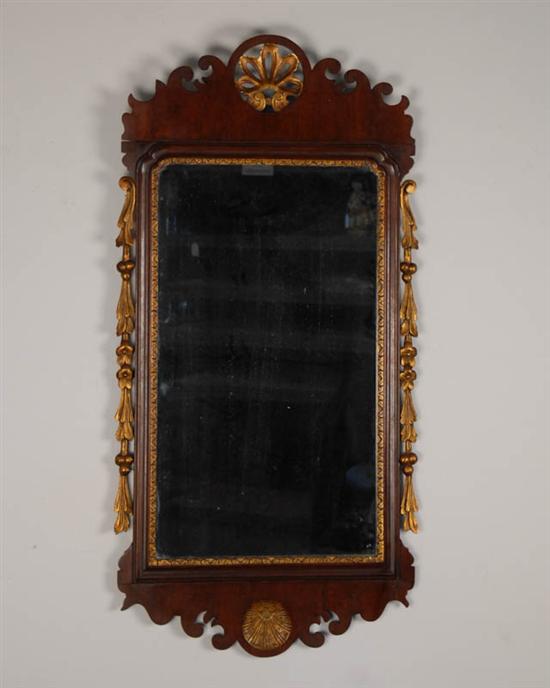 Appraisal: A Chippendale-style Wall Mirror having a mahogany frame with carved