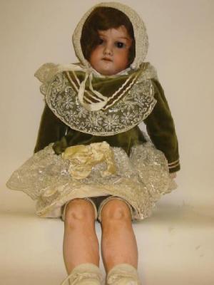 Appraisal: An Armand Marseille bisque shoulder head girl doll with brown