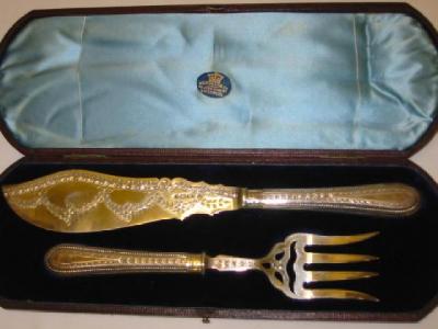 Appraisal: A PAIR OF VICTORIAN FISH SERVERS the blade chased with