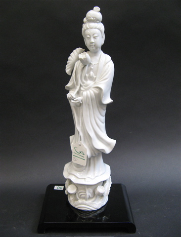 Appraisal: TWO WHITE PORCELAIN FIGURINES One a glazed Chinese Quan Yin