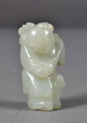 Appraisal: A Fine Chinese Qing Carved Celedon Jade FigureFniely carved to