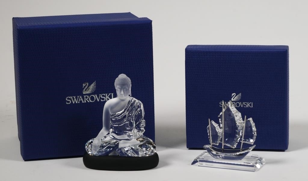 Appraisal: Two crystal figurines by Swarovski including Buddha and Sailing Junk