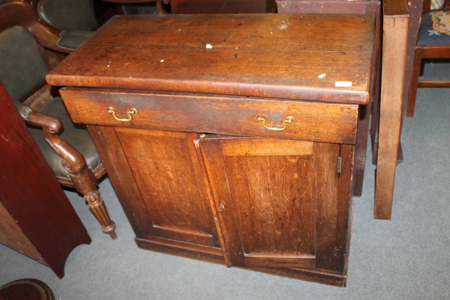 Appraisal: A VICTORIAN OAK SIDE CUPBOARD and a mahogany bedside table