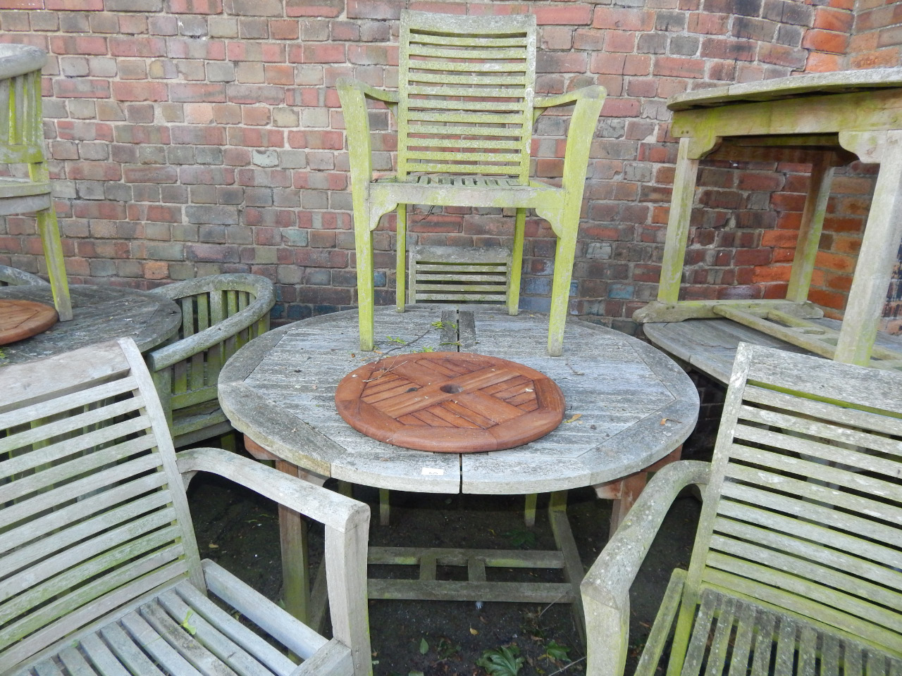 Appraisal: A circular garden table and four carver chairs