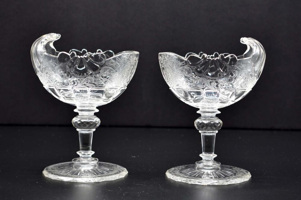 Appraisal: PAIR OF LOBMEYR NAUTILUS-FORM GLASS SWEETMEAT STEM CUPS nd Half