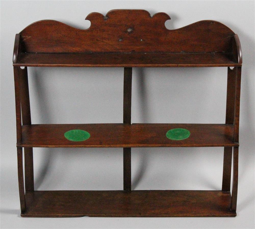 Appraisal: LATE SHERATON MAHOGANY HANGING WALL SHELF having a shaped crest