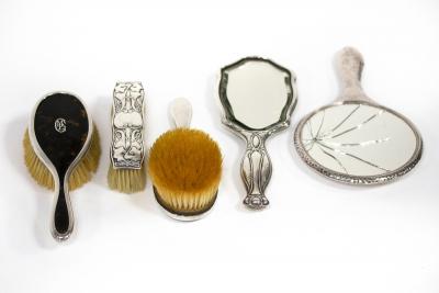 Appraisal: A pair of silver and tortoiseshell backed hairbrushes London and