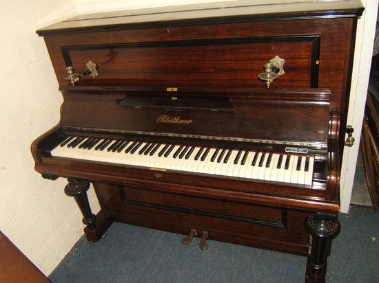 Appraisal: A Julius Bluthner rosewood cased upright piano